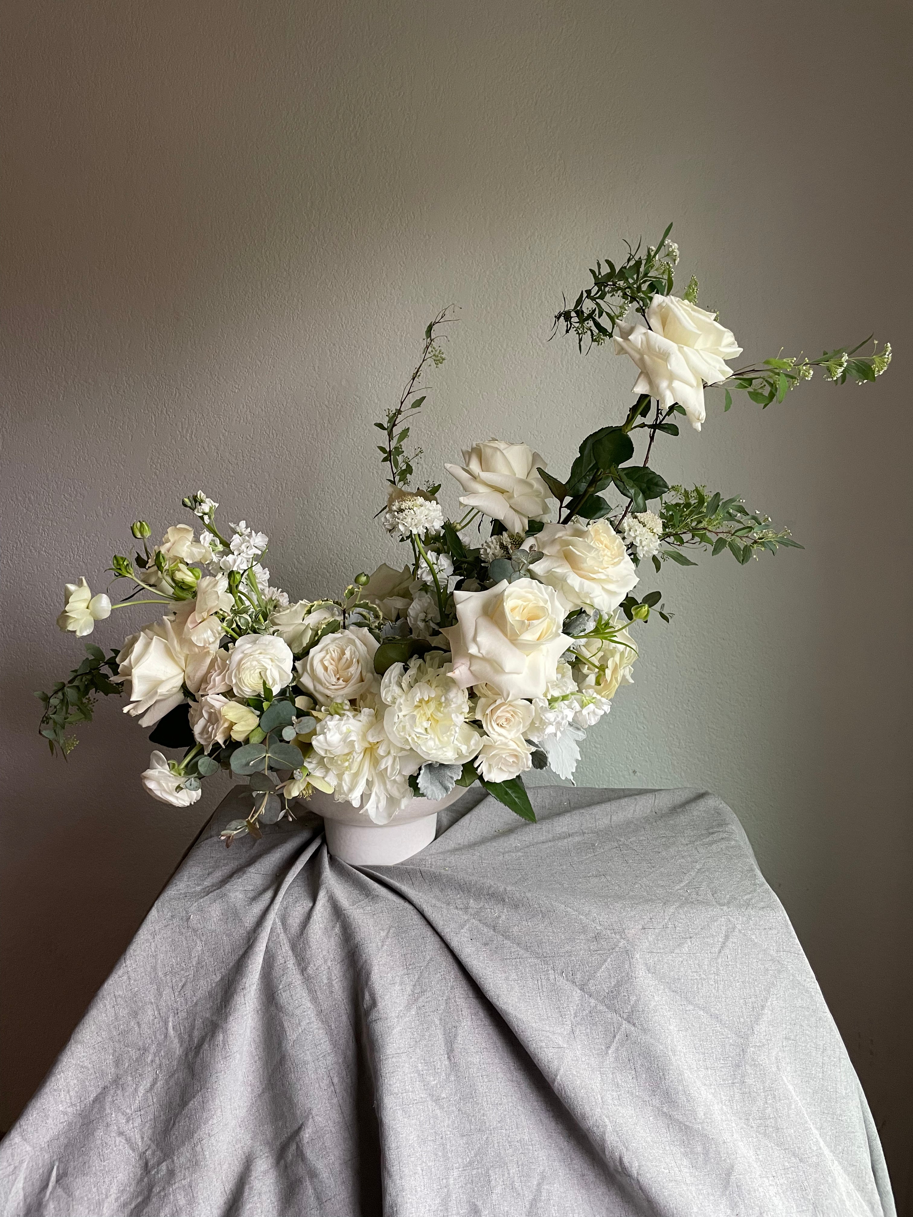 vase arrangement of white and green wedding florals 