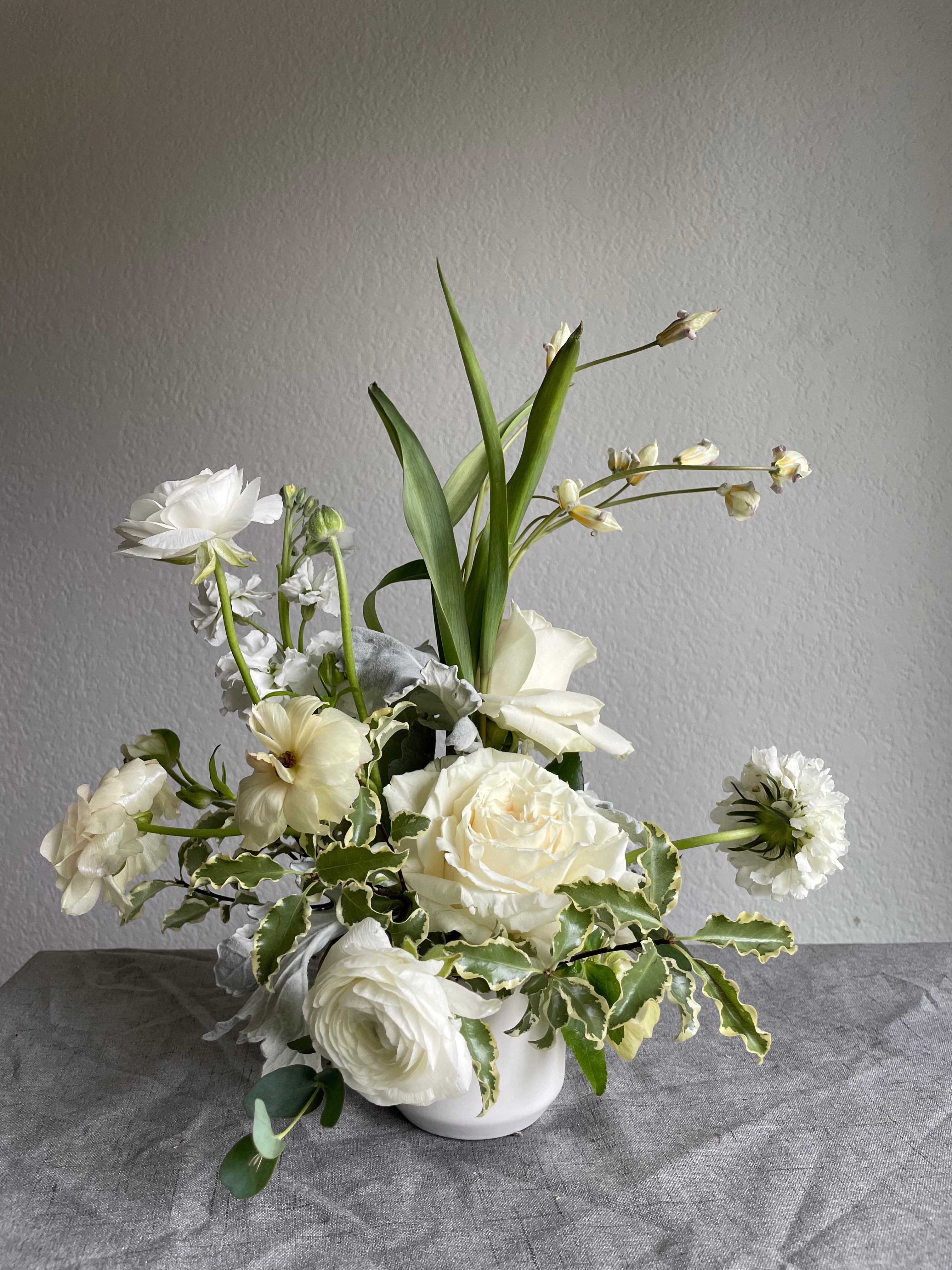 white wedding flower arrangement created with locally sourced flowers