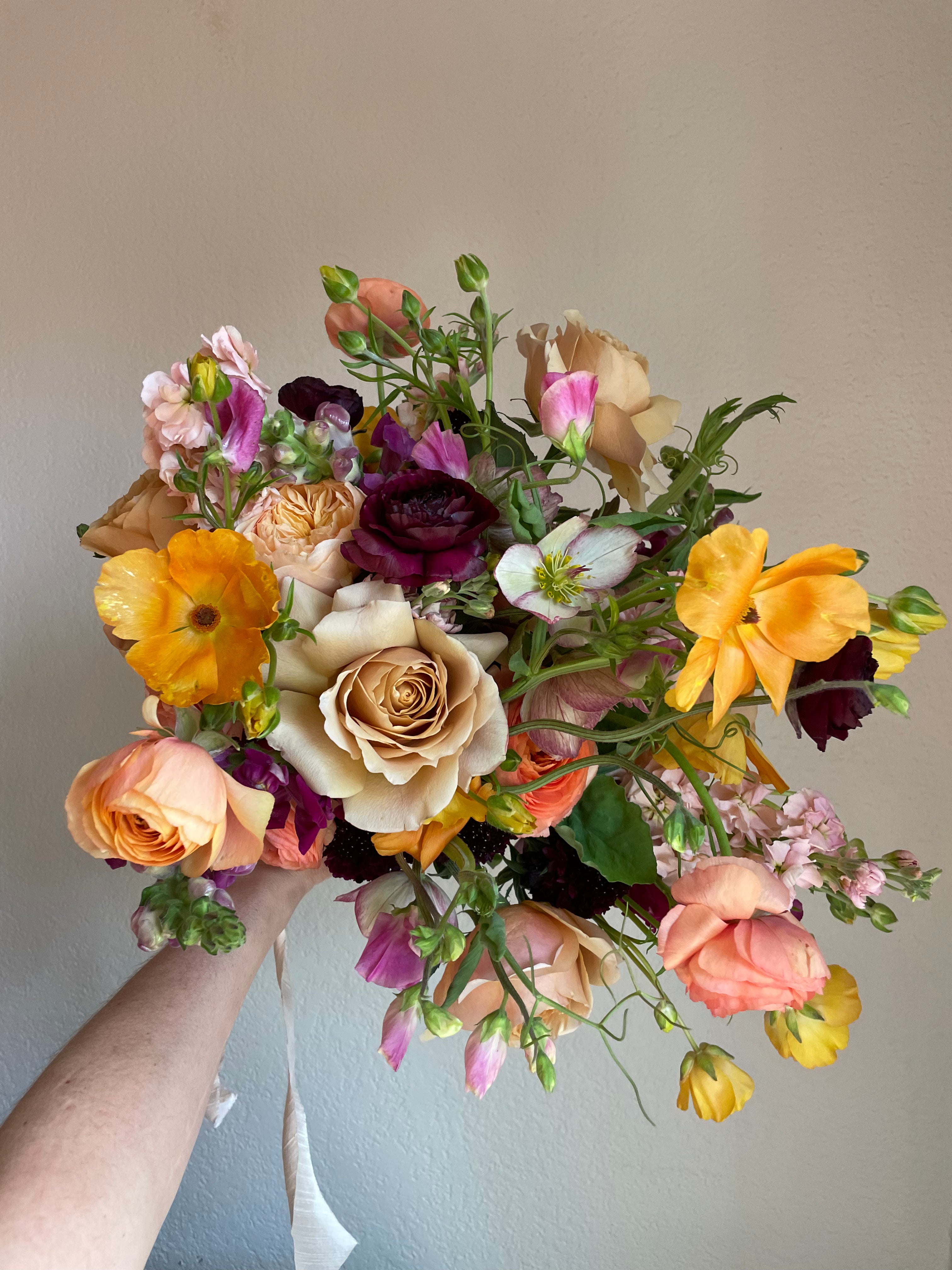 bright and colorful bridal bouquet blending seasonal locally sourced flowers