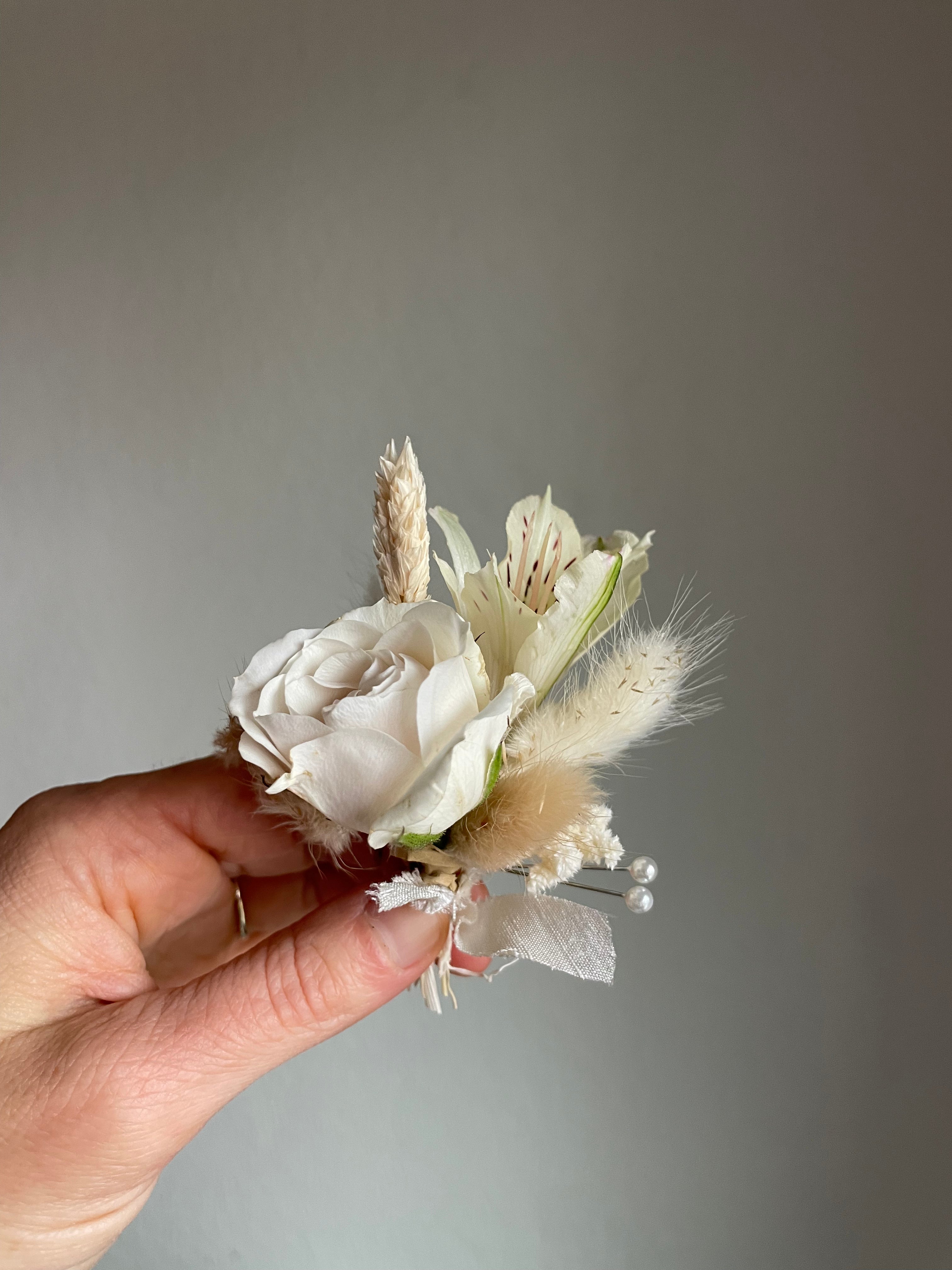 groom's boutonniere with fresh and dried flora
