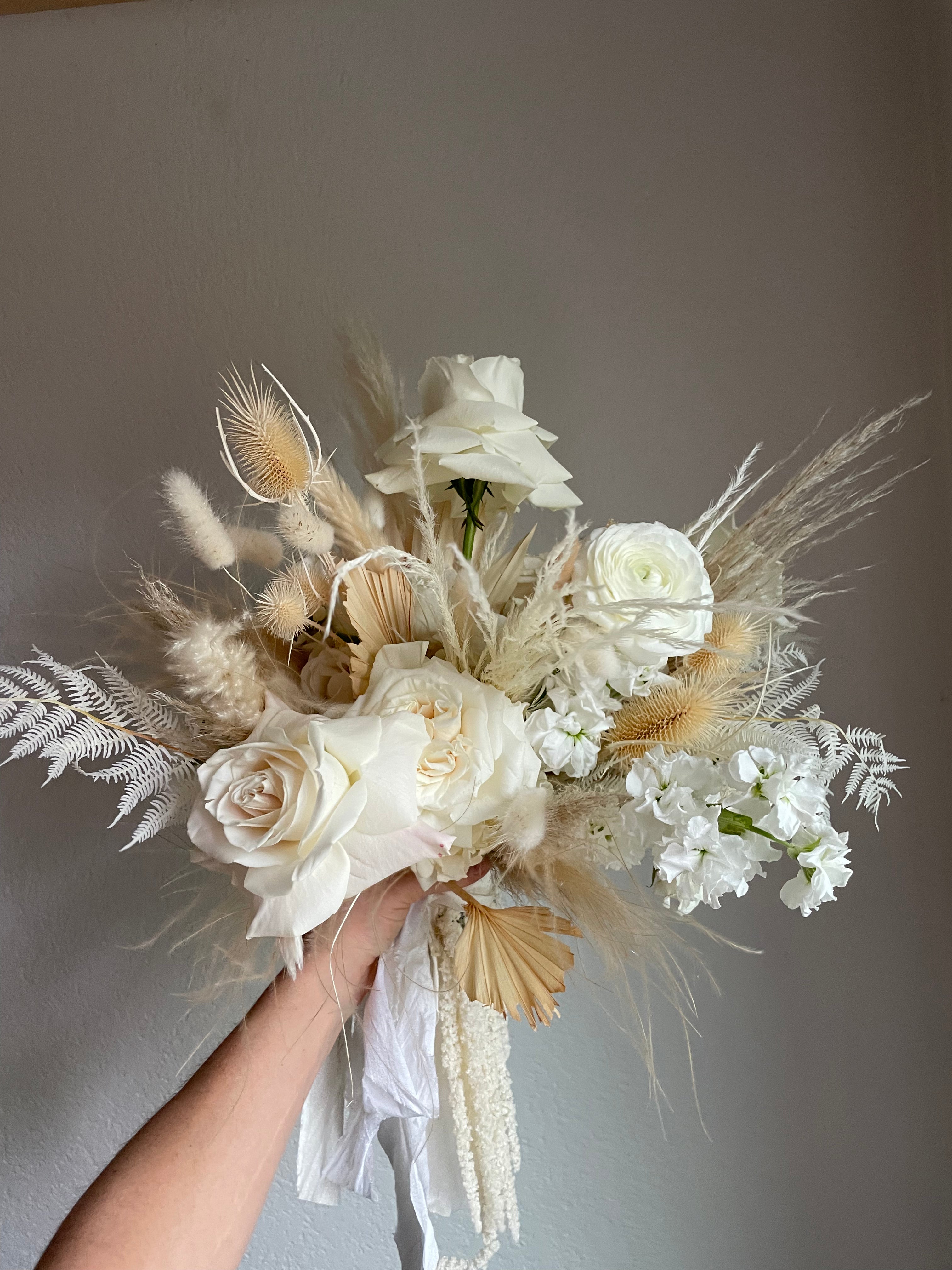 boho wedding bouquet with white and cream fresh flowers, dried and bleached flora