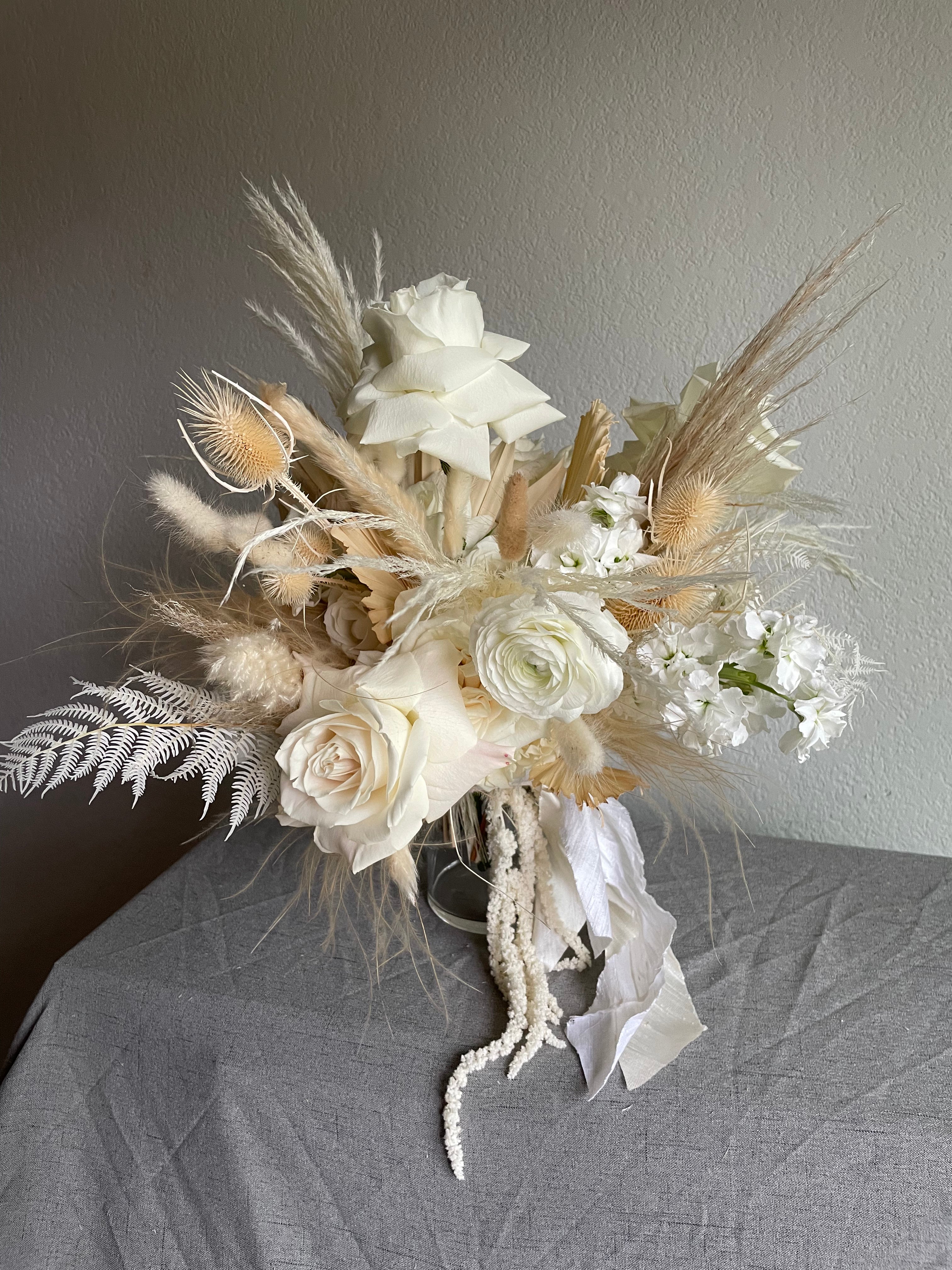 long lasting natural boho bridal bouquet arranged with fresh white and cream flowers 